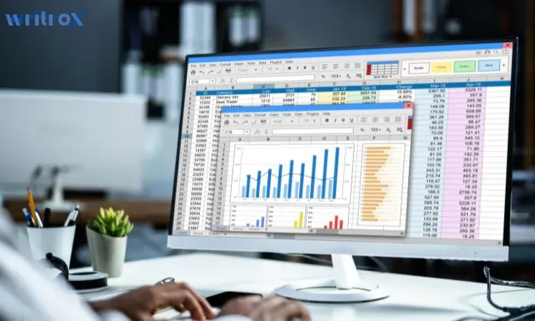 data analyst reviewing charts and spreadsheets on desktop screen